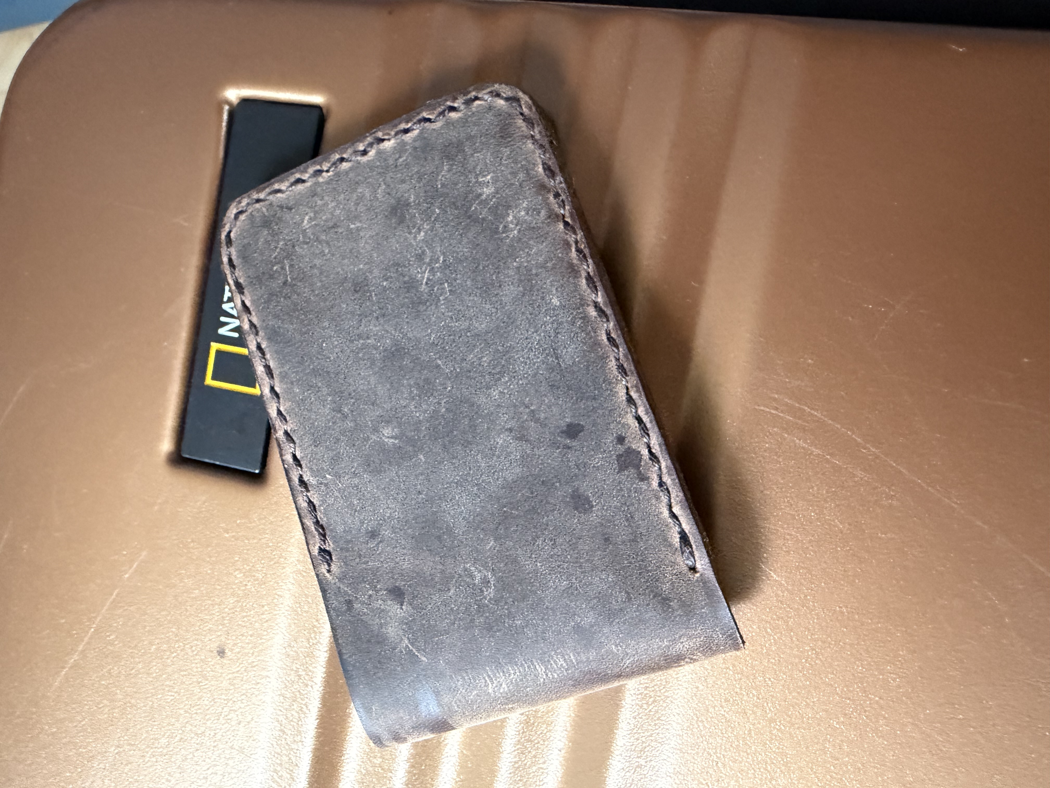 Closed grey folding wallet in crazy horse pull-up leather