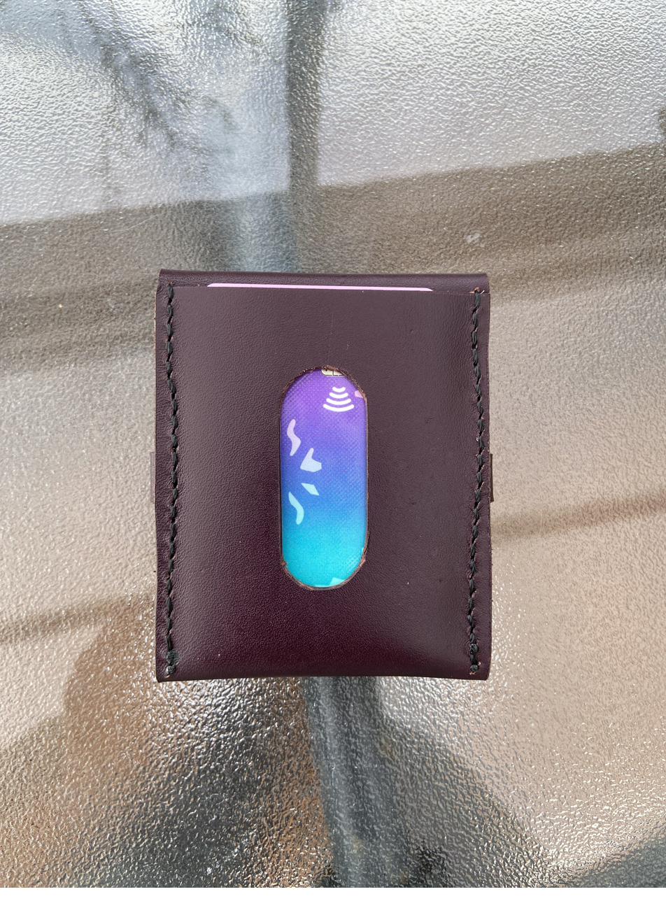 Wallet with a keycard visible through an oval cut-out window